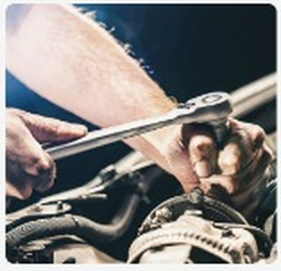 Mechanic servicing a car